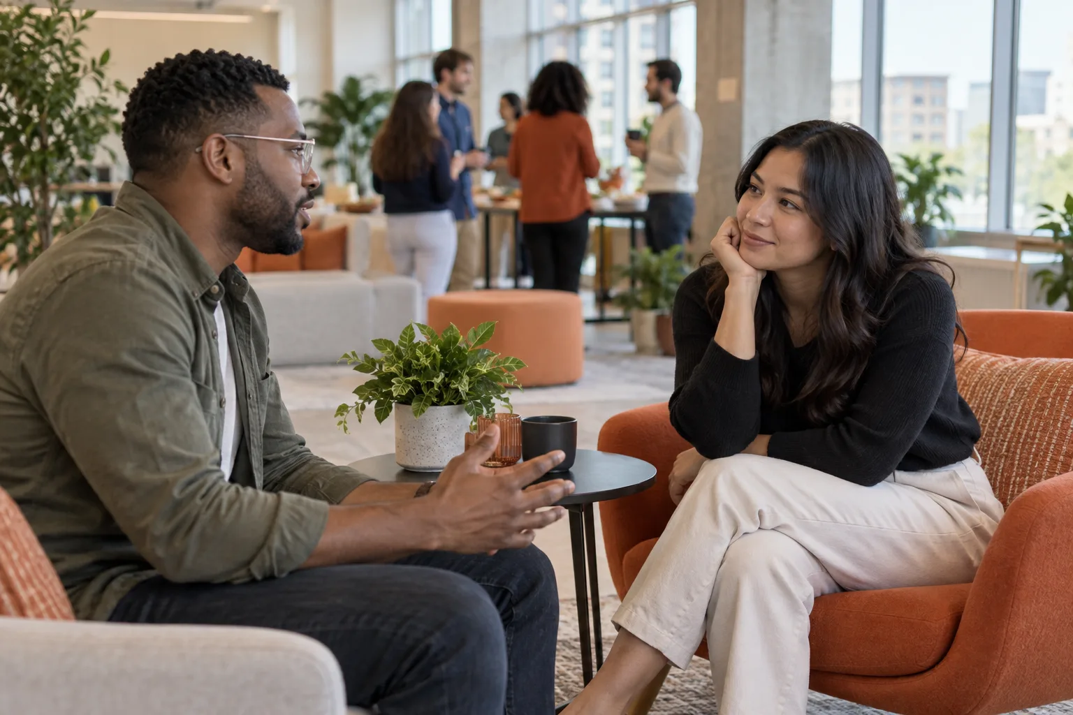 Two people having a relaxed conversation during a small group gathering